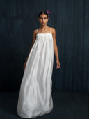 Flowing ivory white mulberry silk maxi dress with thin straps and gathered bust, handcrafted sustainable luxury gown for bridal, evening, and resort wear