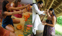 On the left side, several people are sitting on the floor engaged in a creative activity involving flower petals and fabric. On the right side, a man dressed in white is performing a gentle ceremonial gesture for two women, perhaps applying something to their foreheads as part of a blessing or ritual.