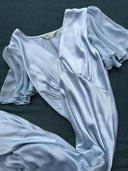 The Olivia Vintage Silk Dress - Aquamarine by Rimmba | Sustainable Clothing features luxurious mulberry silk satin, short sheer flutter sleeves, a deep V-neckline, gentle bust gathering, and a flowing vintage-inspired silhouette.