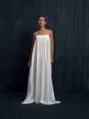 Ivory white mulberry silk maxi dress with thin straps and gathered bust detail, handcrafted sustainable luxury fashion for bridal, formal, and resort wear.