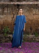 Front view of indigo blue mulberry silk kaftan with white vertical line detail, handcrafted botanical-dyed maxi dress for sustainable luxury fashion, perfect for resort, evening, and formal wear