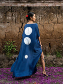 Back view of indigo blue mulberry silk kaftan with three white circular motifs, handcrafted botanical-dyed maxi dress with side slit, sustainable luxury resort and evening wear

