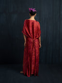 Back view of red eco-dyed mulberry silk kaftan with gathered waist tie and slit hem, handcrafted botanical-dyed maxi dress for sustainable luxury resort and formal wear