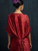 Close-up back detail of red eco-dyed mulberry silk kaftan with gathered waist tie, handcrafted botanical-dyed sustainable maxi dress for luxury resort and formal fashion