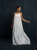 Elegant ivory white mulberry silk maxi dress with thin straps and flowing skirt, handcrafted sustainable luxury gown for bridal celebrations, formal evenings, and resort fashion