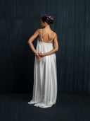 Back view of ivory white mulberry silk maxi dress with thin straps and smocked detail, handcrafted sustainable luxury gown for bridal, formal, and resort wear