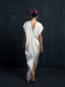 Back view of ivory white mulberry silk kaftan with open tie-back detail, handcrafted eco-friendly maxi dress with slit hem, sustainable bridal and resort wear