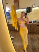 A woman standing mirror selfie wearing Mulberry silk seath skirt Marigold colour and Silk bra marigold. 
