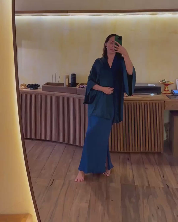 An indoors video of Karunia Fischer's wearing Mulberry Silk Aman Skirt indigo and matching silk kimono. 